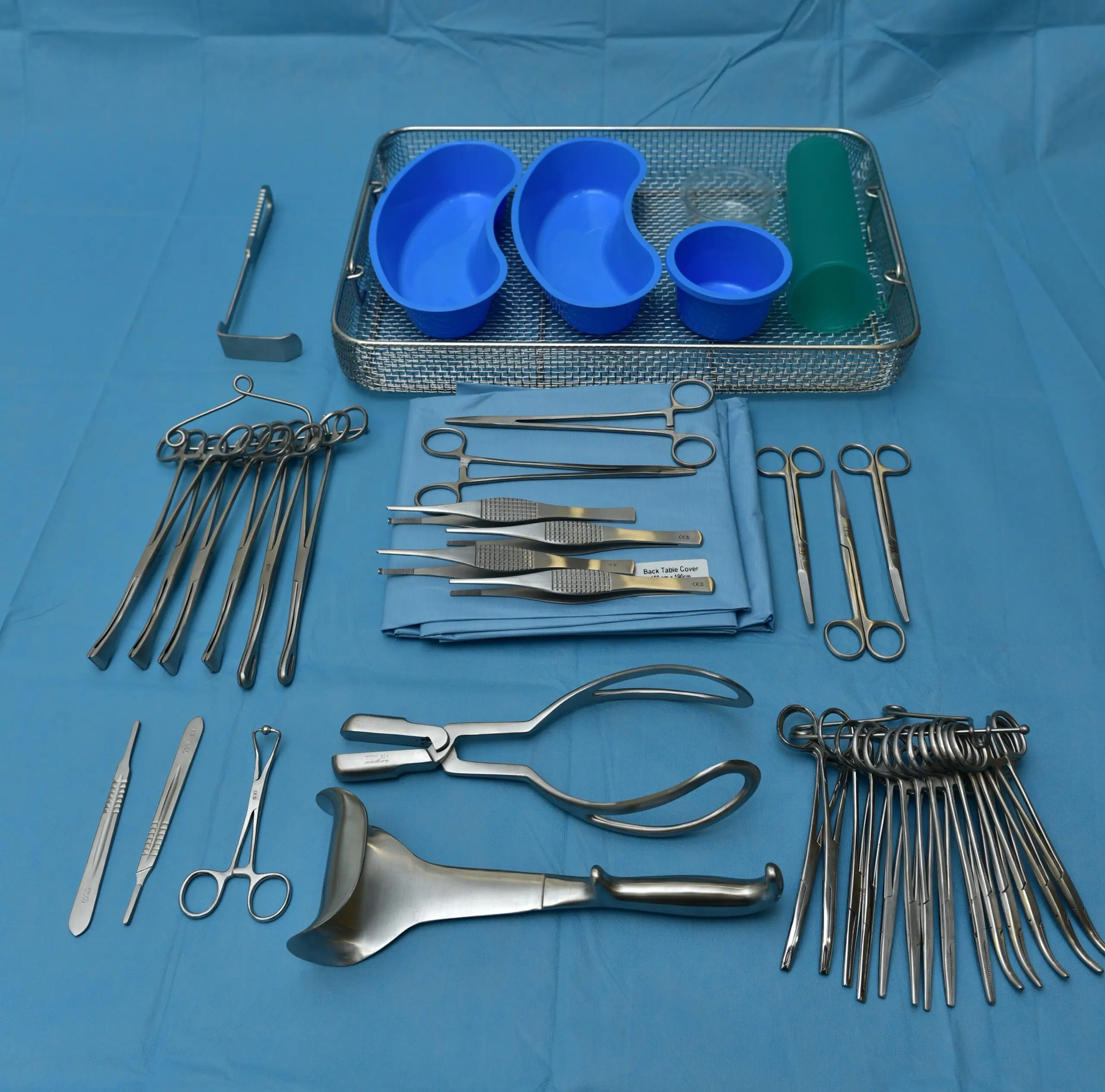 a variety of surgical items are laid out on a table.
